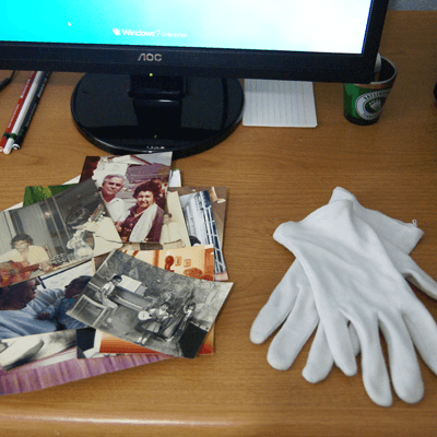 Photos with white gloves ready for scanning